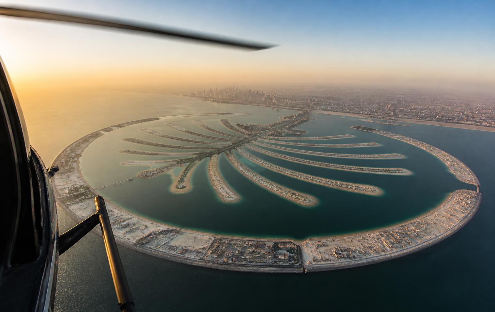 Palm Jebel Ali from a helicopter at golden hour